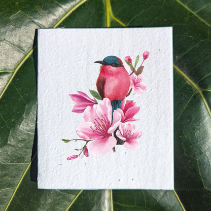 Pink bird on pink flowers on card